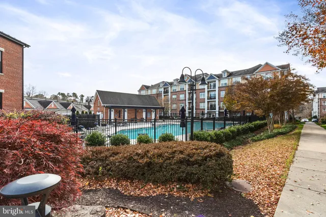 a view of a house with yard and sitting area