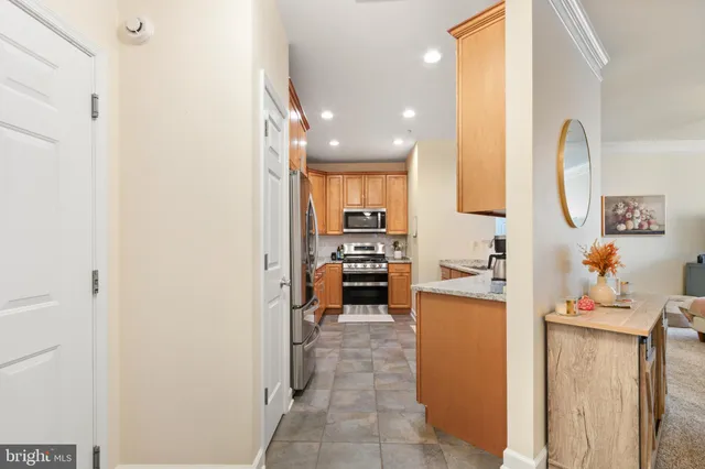 a kitchen with a refrigerator and a sink