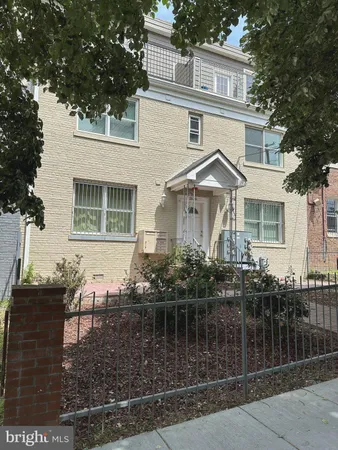 a front view of a house with a balcony