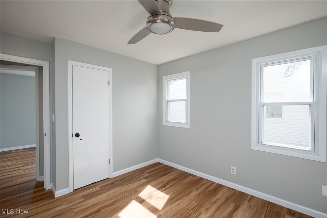 4782 Belle Meadow Road Mentor, OH 44060 - Photo 21 of 22 Unfurnished bedroom featuring a closet, light wood-type flooring, and ceiling fan