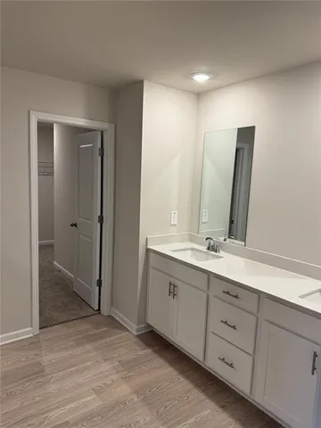 a bathroom with a glass shower door
