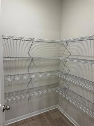 a view of a room with racks on the wall