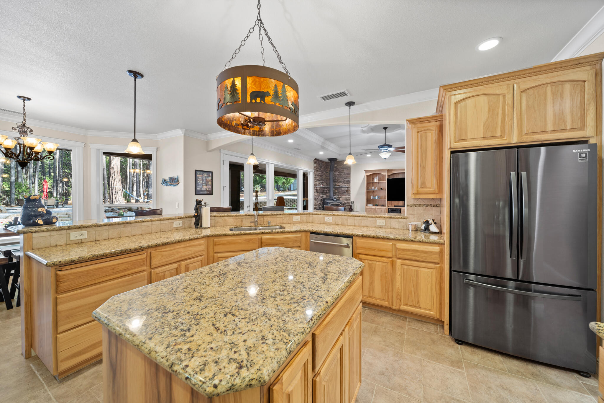 7795 Eastmoore Road Shingletown, CA 96088 - Photo 14 of 61 a kitchen with stainless steel appliances granite countertop a stove refrigerator and microwave