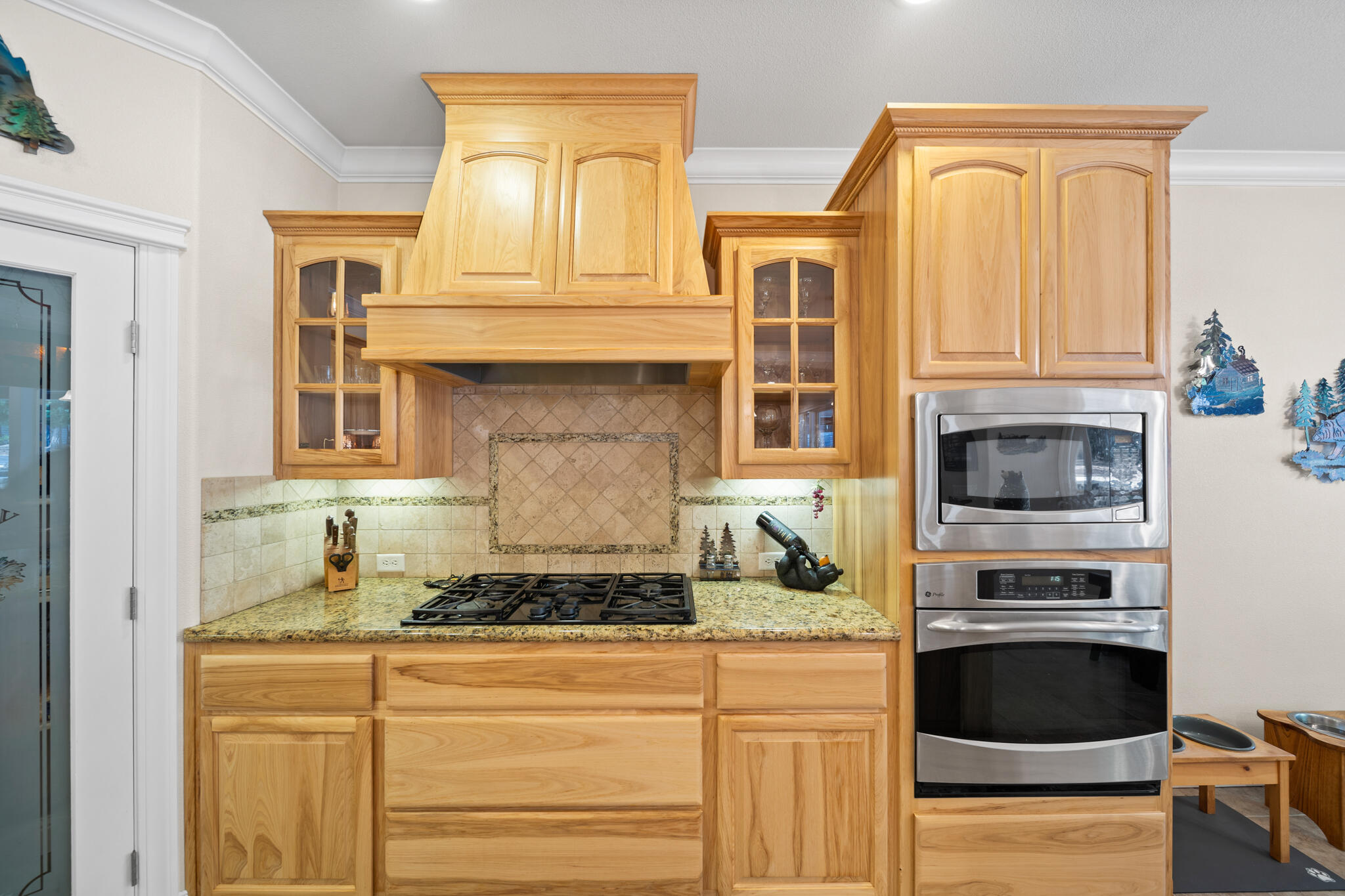 7795 Eastmoore Road Shingletown, CA 96088 - Photo 15 of 61 a kitchen with granite countertop a stove and a white refrigerator