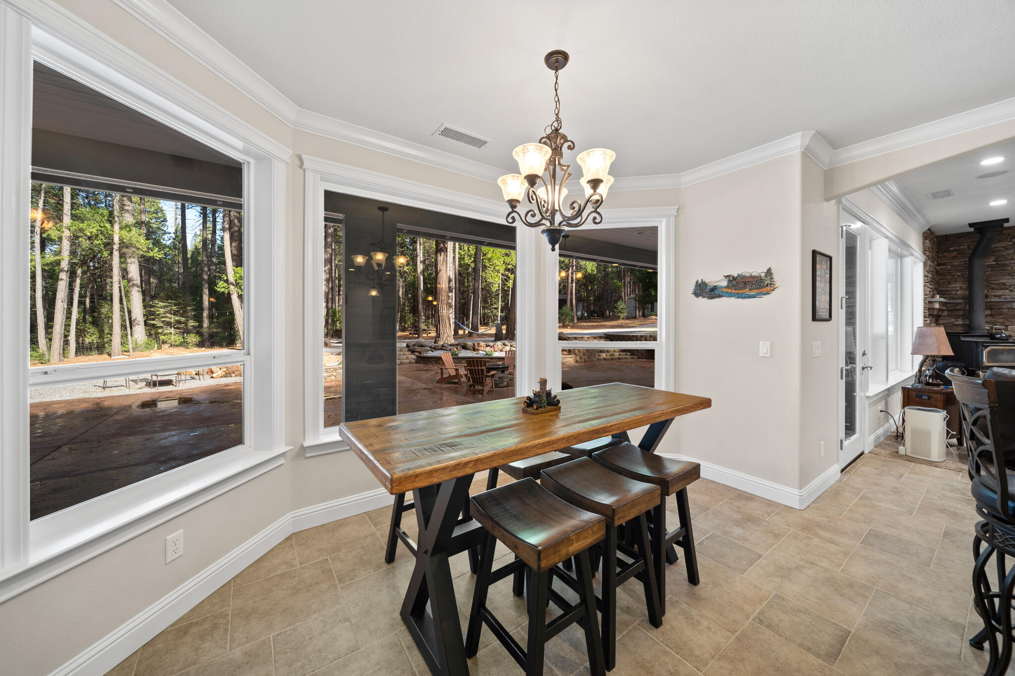 7795 Eastmoore Road Shingletown, CA 96088 - Photo 17 of 61 a view of a dining room with furniture window and wooden floor