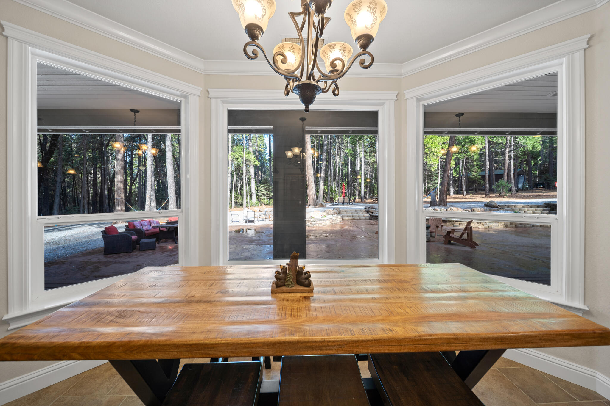 7795 Eastmoore Road Shingletown, CA 96088 - Photo 18 of 61 a view of a dining room with furniture wooden floor and chandelier