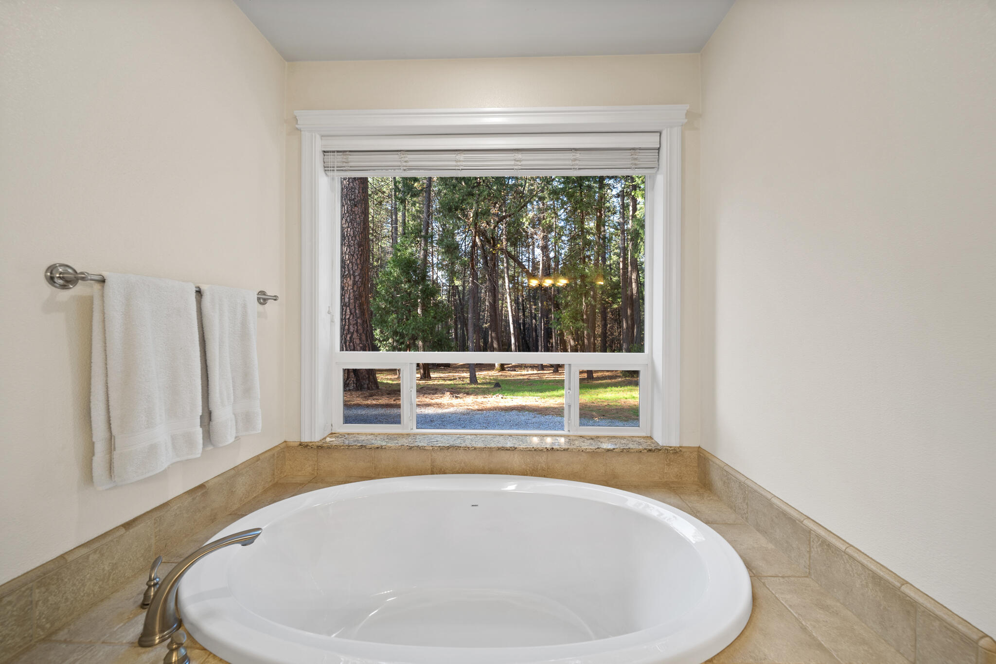 7795 Eastmoore Road Shingletown, CA 96088 - Photo 23 of 61 a view of a bathtub in a room