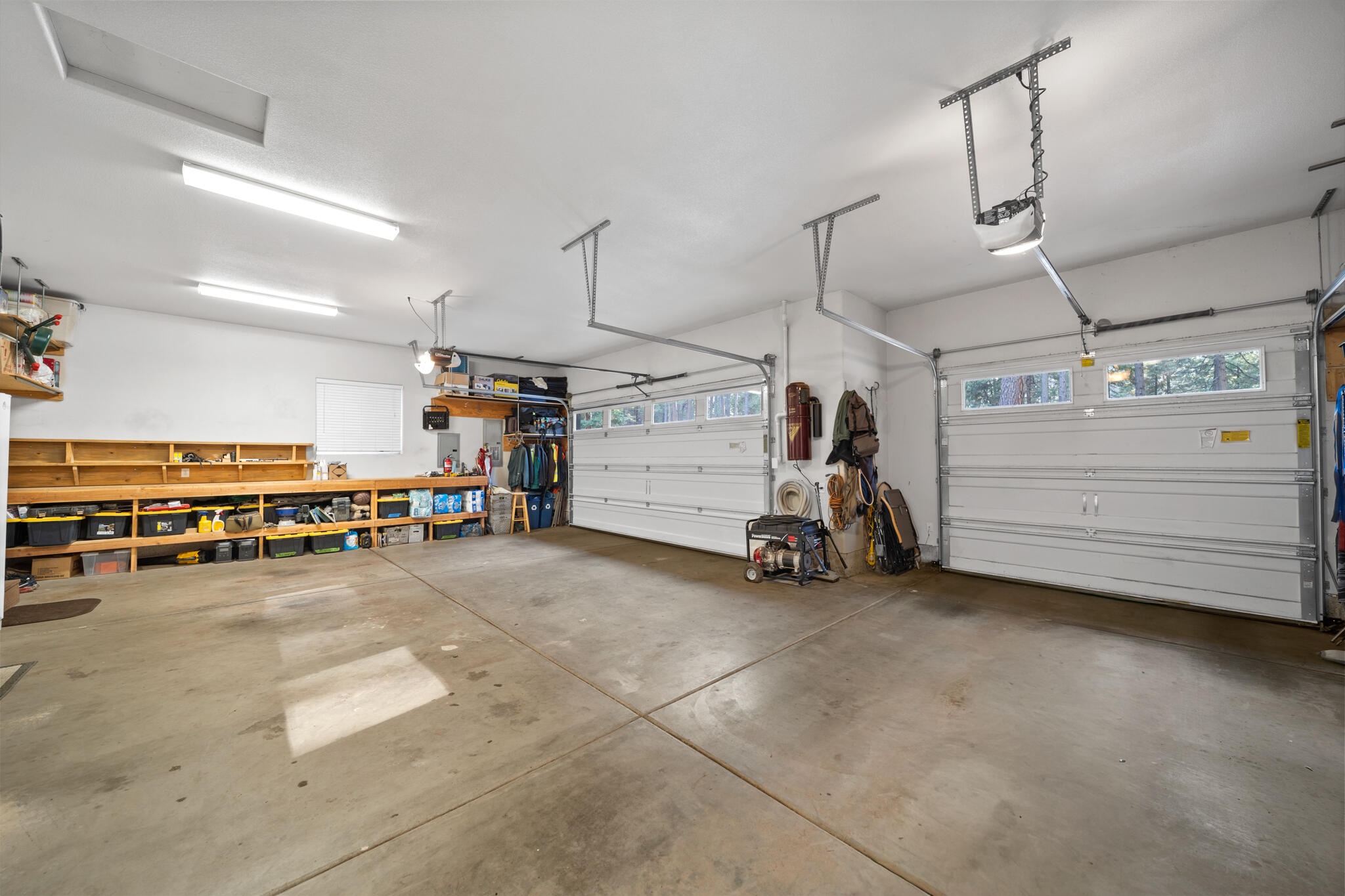 7795 Eastmoore Road Shingletown, CA 96088 - Photo 34 of 61 a view of a garage with furniture and a garage