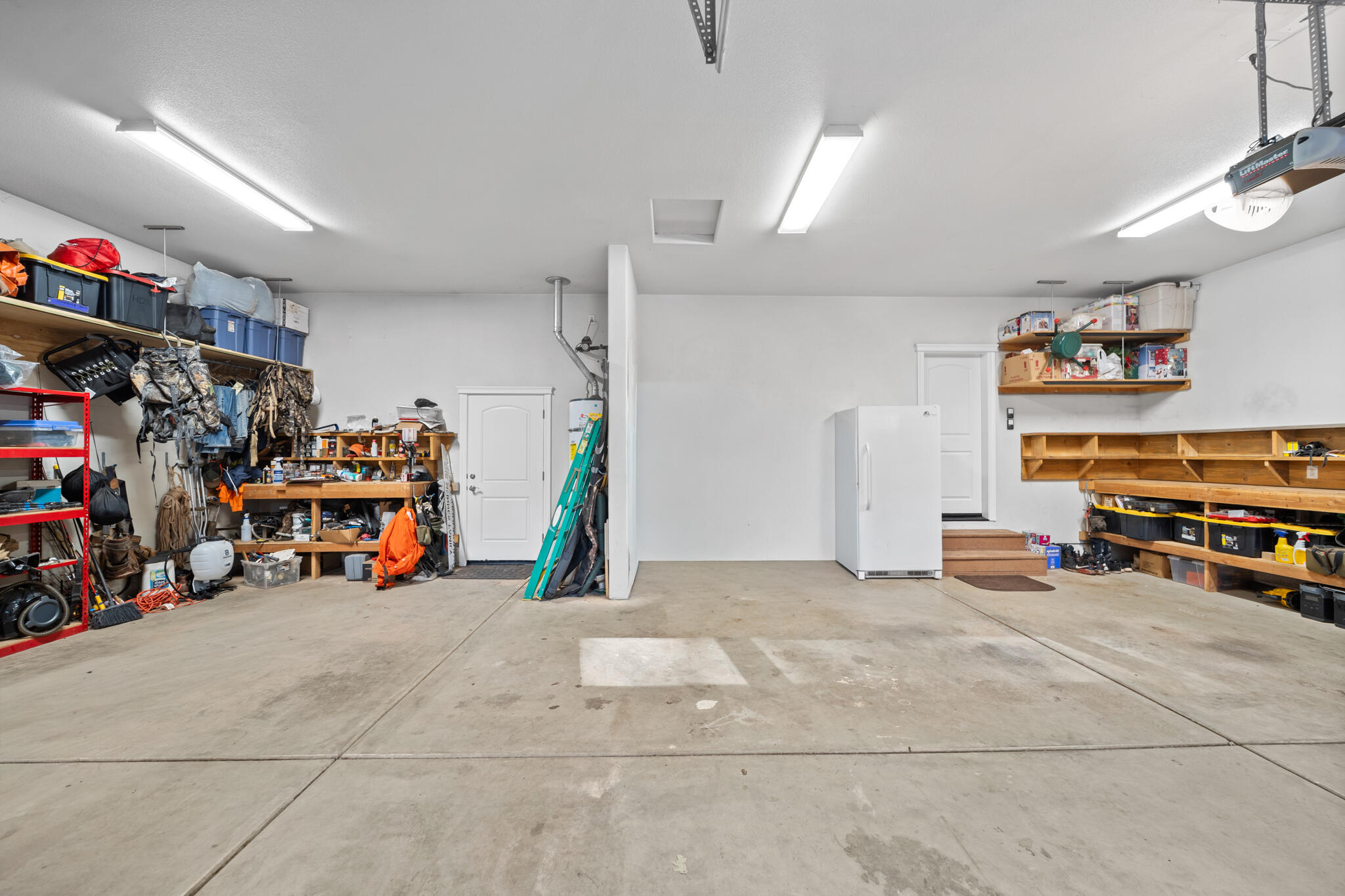 7795 Eastmoore Road Shingletown, CA 96088 - Photo 35 of 61 a view of a garage with a bike and other equipment