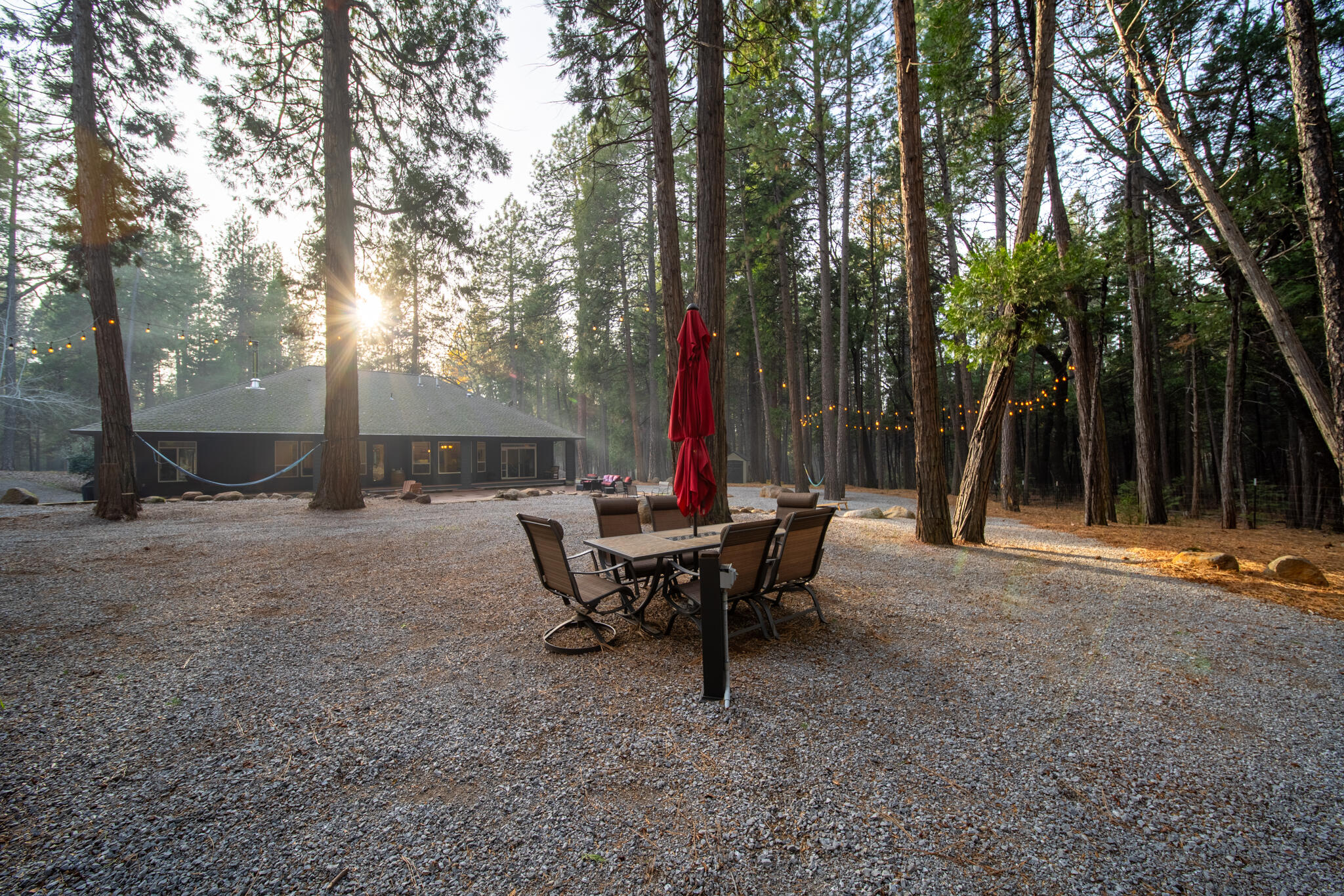 7795 Eastmoore Road Shingletown, CA 96088 - Photo 47 of 61 a view of a house with backyard and sitting area