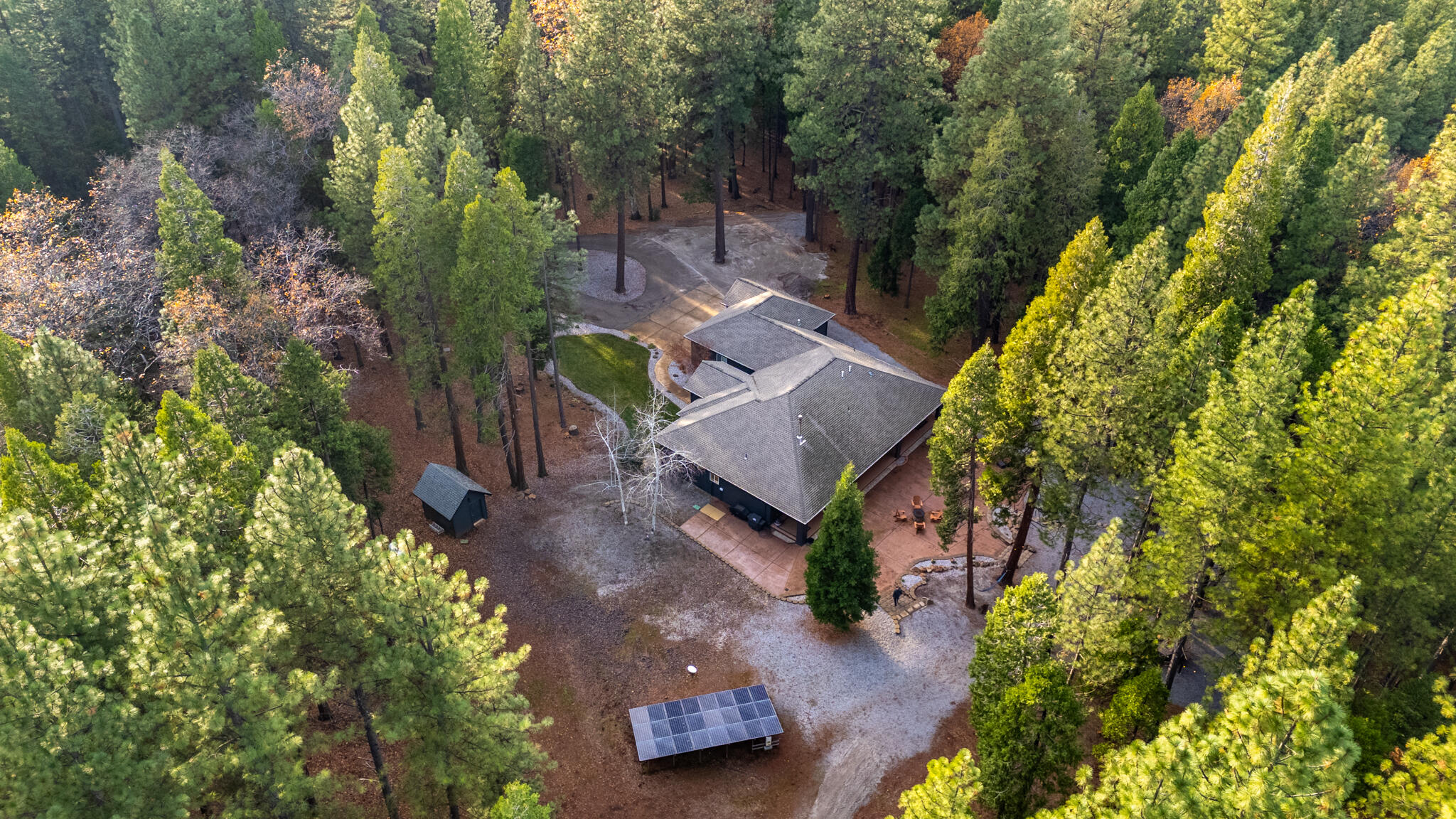 7795 Eastmoore Road Shingletown, CA 96088 - Photo 54 of 61 an aerial view of a house with a yard basket ball court and outdoor seating