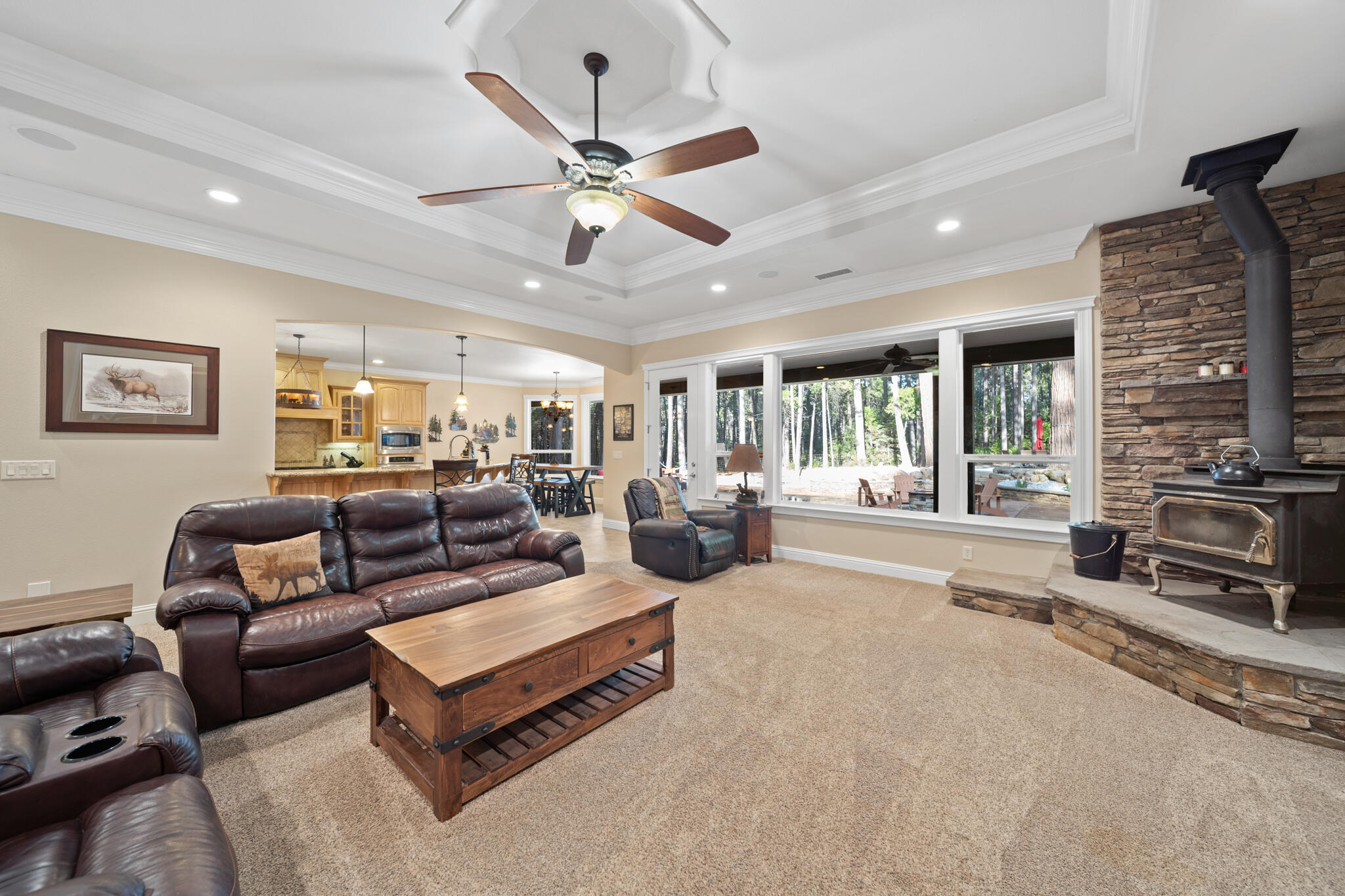 7795 Eastmoore Road Shingletown, CA 96088 - Photo 8 of 61 a living room with furniture a ceiling fan and a flat screen tv