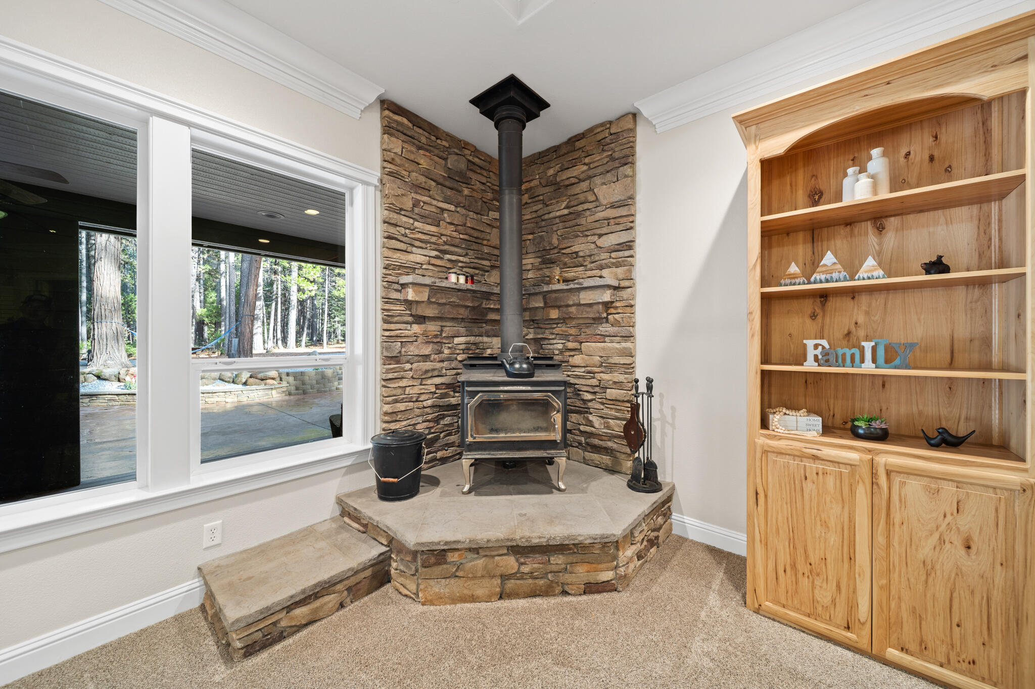 7795 Eastmoore Road Shingletown, CA 96088 - Photo 9 of 61 a living room with furniture and a fireplace