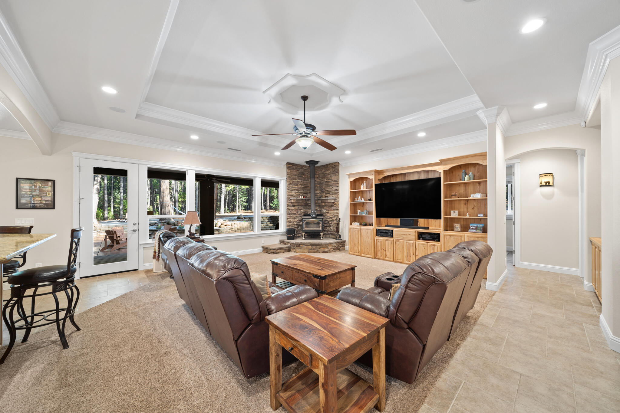 7795 Eastmoore Road Shingletown, CA 96088 - Photo 10 of 61 a living room with furniture kitchen view and a flat screen tv