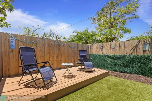 a patio with yard table and chairs