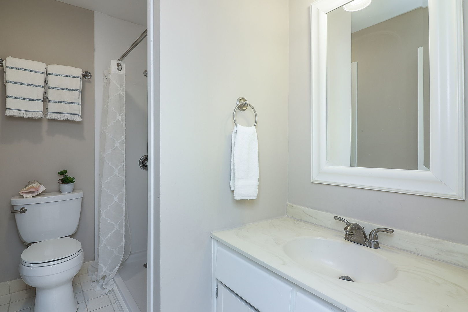 1657 Dover Court, Unit D Wheaton, IL 60189 - Photo 11 of 15 a bathroom with a toilet sink and mirror
