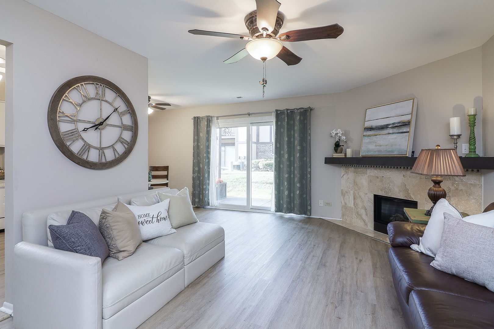 1657 Dover Court, Unit D Wheaton, IL 60189 - Photo 2 of 15 a living room with furniture and a fireplace