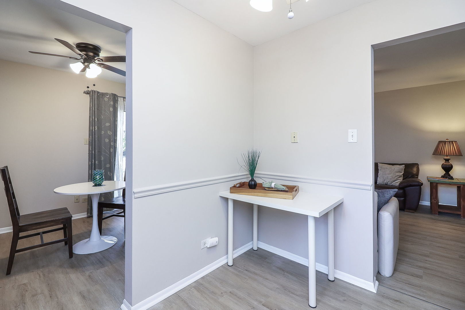 1657 Dover Court, Unit D Wheaton, IL 60189 - Photo 8 of 15 a room with furniture and wooden floor