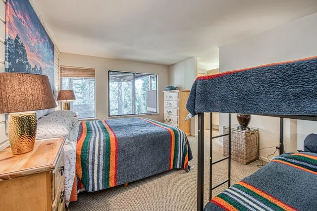 a spacious bedroom with a bed and window