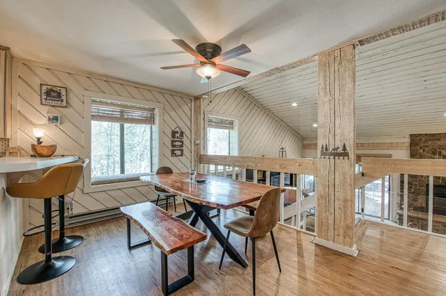 a dining room with furniture and window