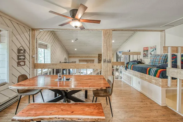 a view of a dining room with furniture and a rug