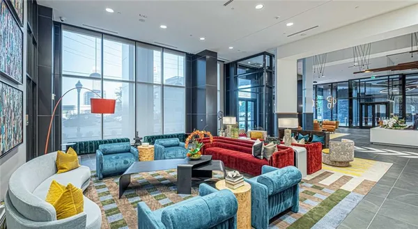a living room with furniture and a large window