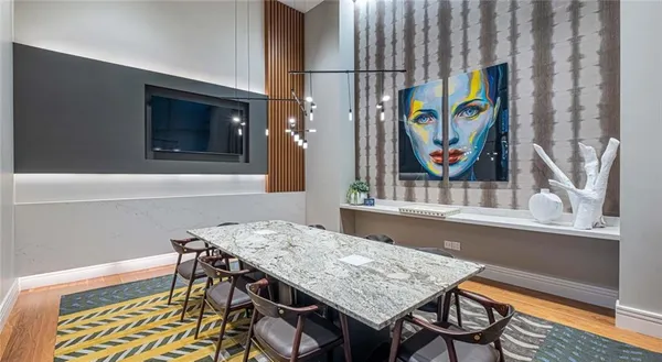 a dining room with a table and chairs