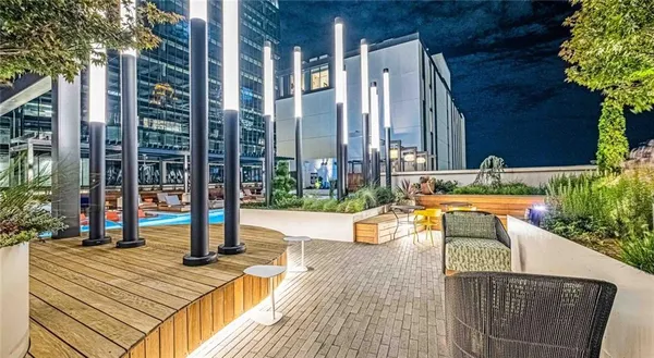 a view of a swimming pool with a lounge chairs