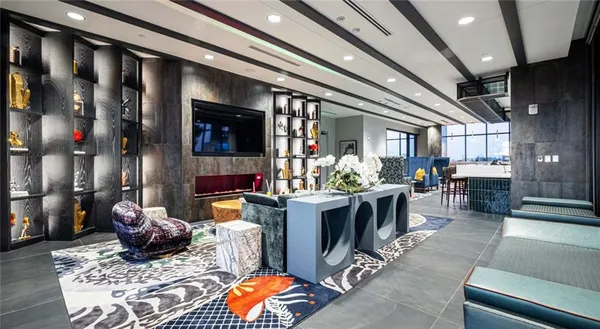 a living room with furniture and flat screen tv