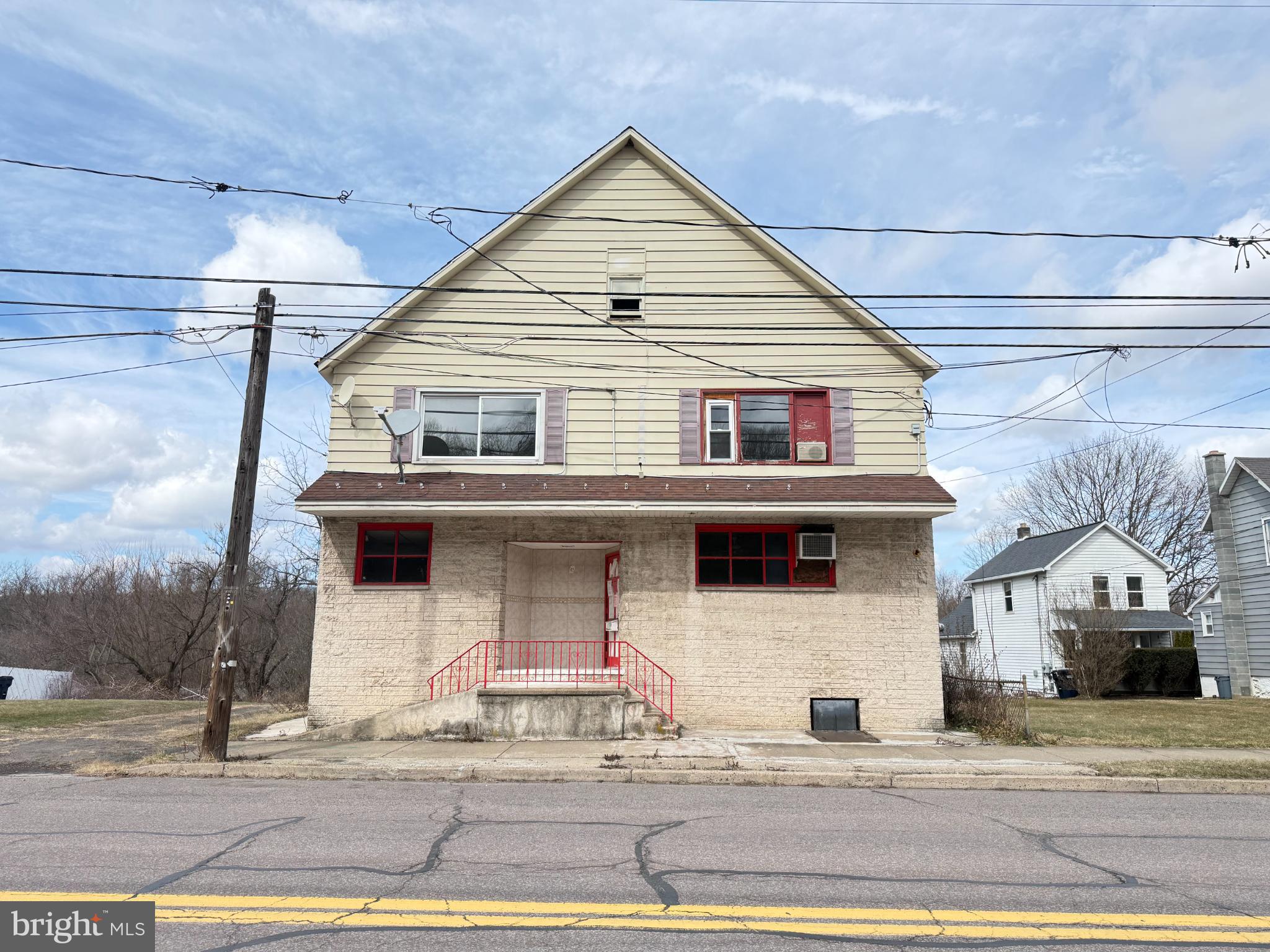 a front view of a house with garage