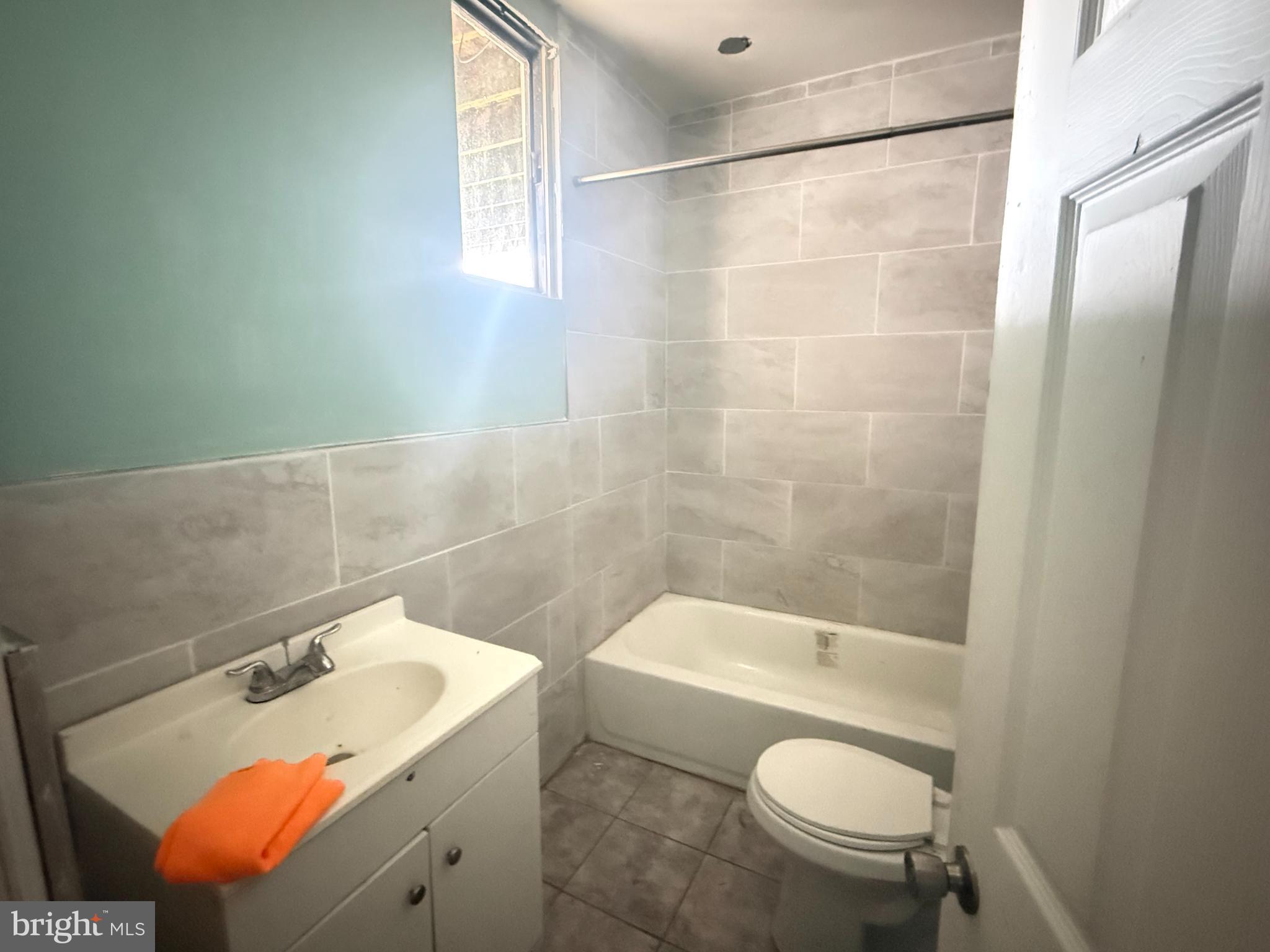 863 Main Street Sugar Notch, PA 18706 - Photo 7 of 10 a bathroom with a sink mirror vanity and toilet