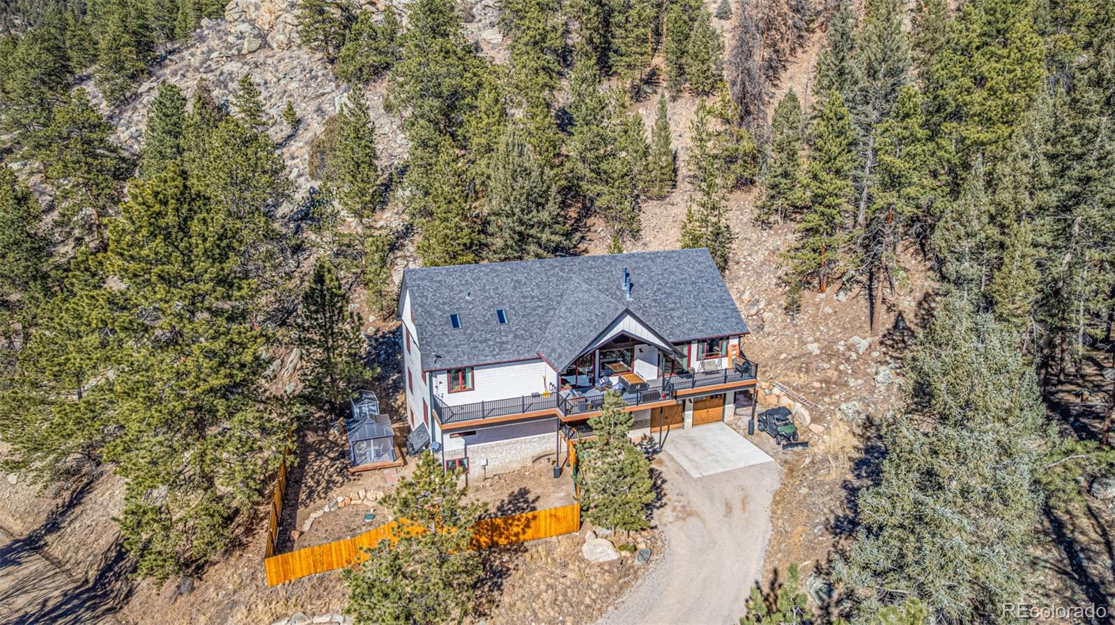 663 Brookside Drive Bailey, CO 80421 - Photo 43 of 47 an aerial view of a house with yard and outdoor seating