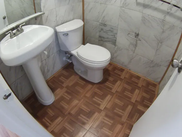 a bathroom with a toilet and a sink