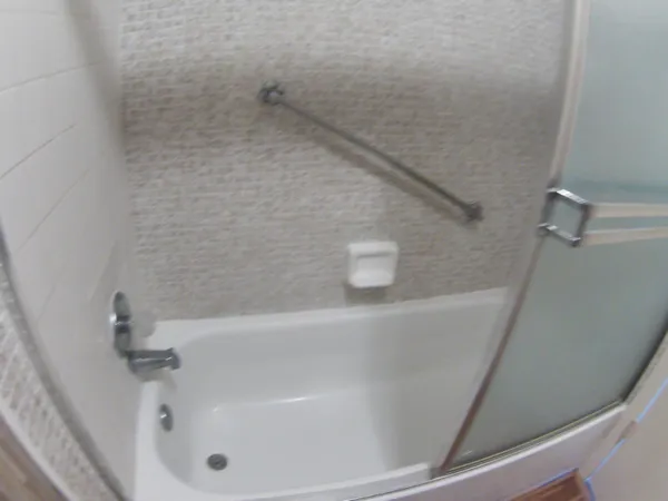 a bath tub sitting in a bathroom