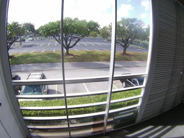 a view of a balcony with a tree