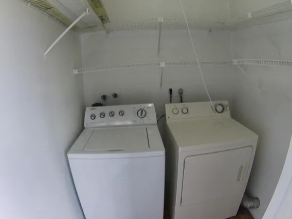 a utility room with dryer and washer