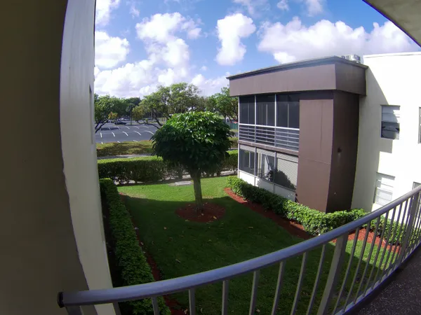 a view of a porch with a yard