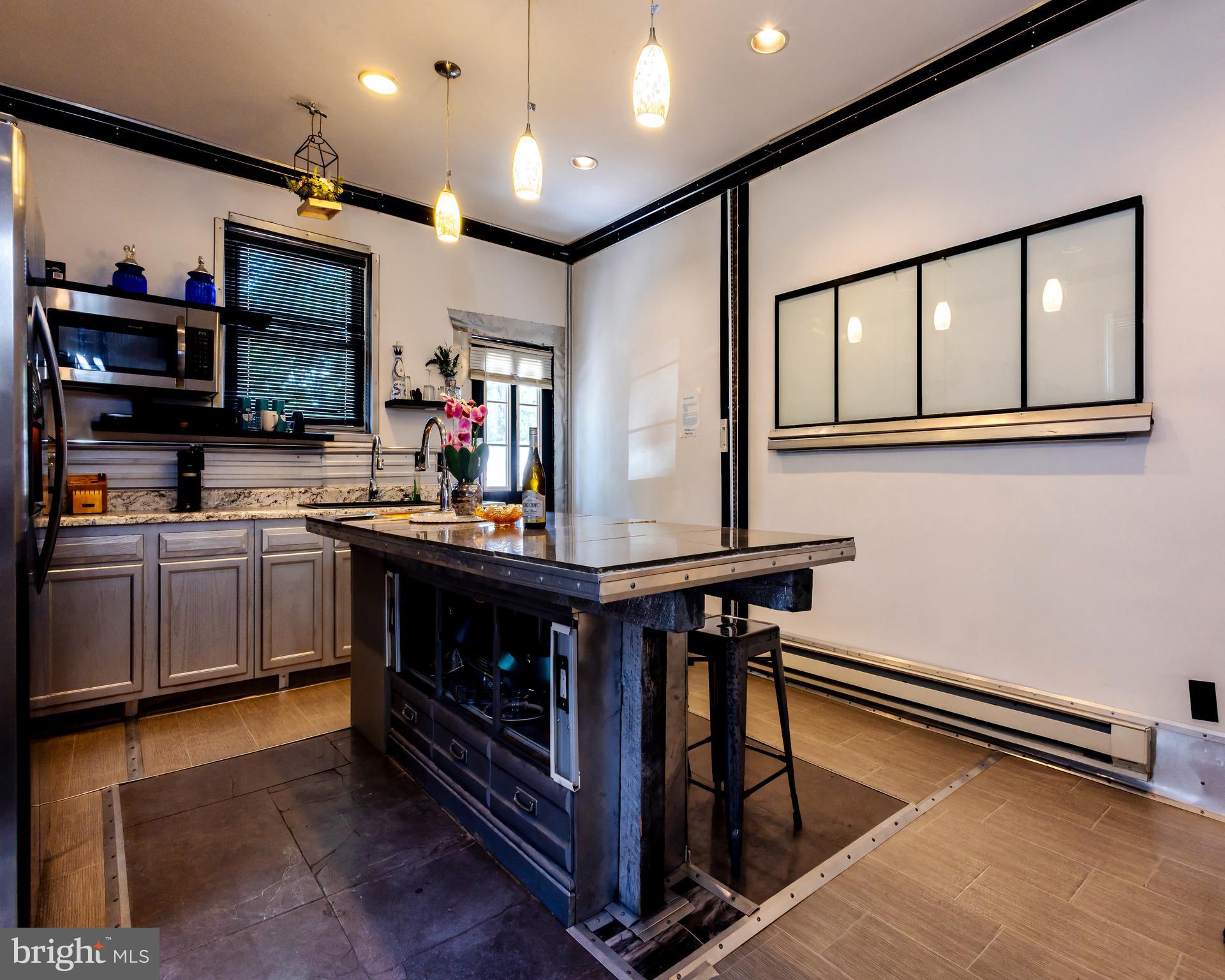 424 State Street Camden, NJ 08102 - Photo 15 of 36 a kitchen with stainless steel appliances granite countertop a stove and a sink