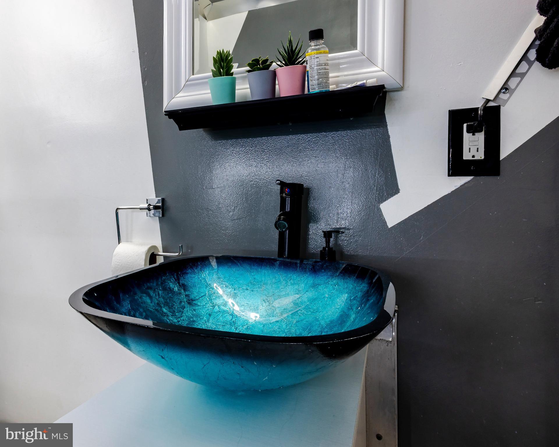 424 State Street Camden, NJ 08102 - Photo 19 of 36 a bathroom with a sink and a mirror