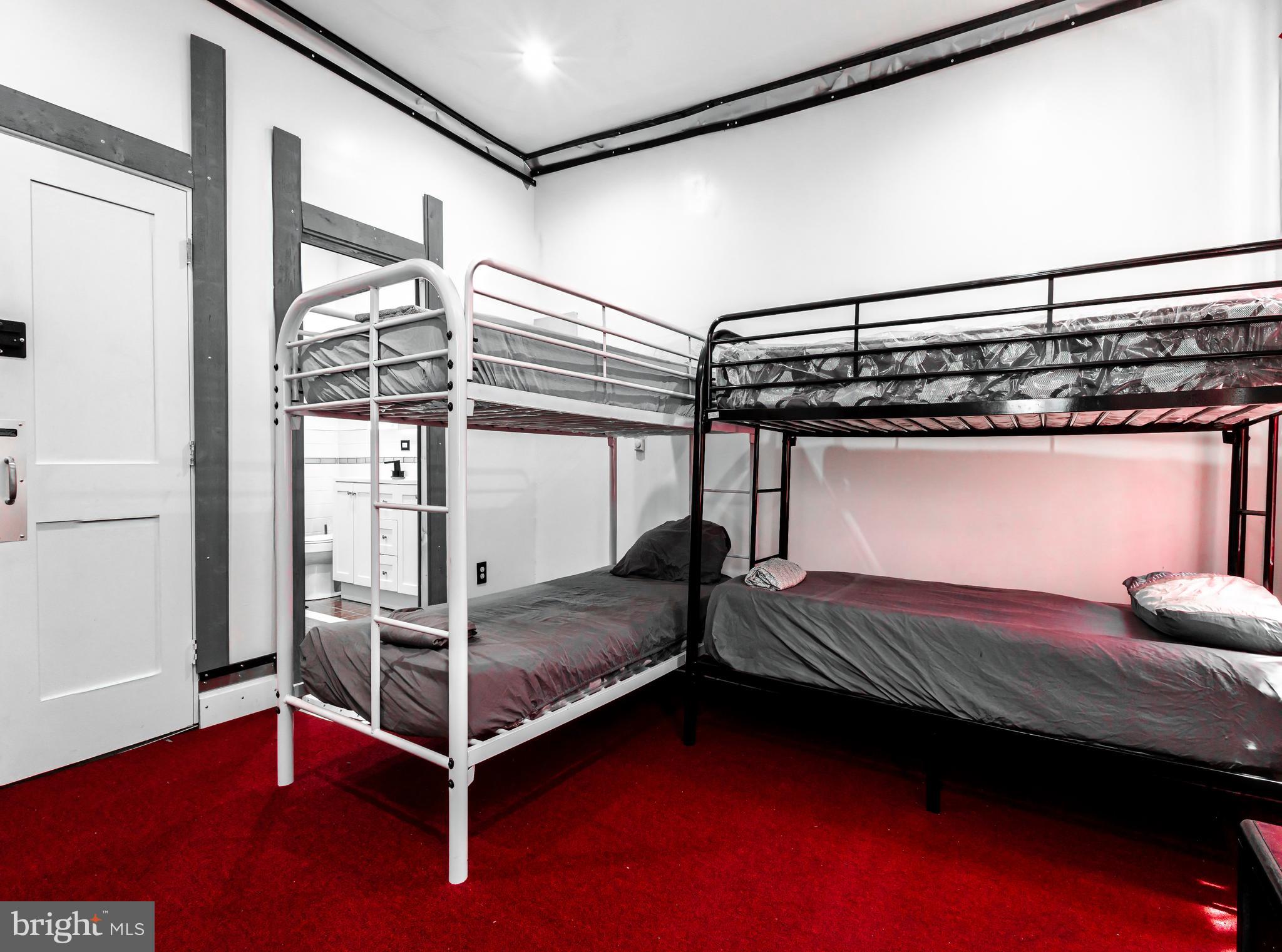 424 State Street Camden, NJ 08102 - Photo 24 of 36 a bedroom with double bunk beds and a window