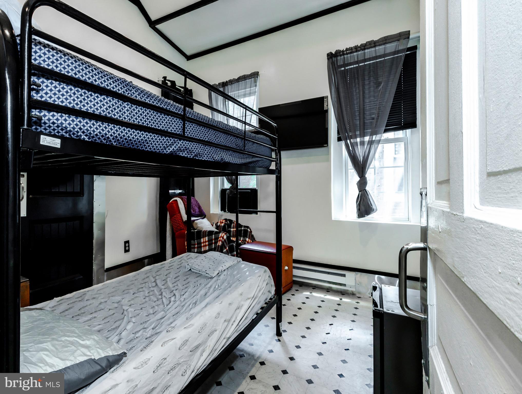 424 State Street Camden, NJ 08102 - Photo 25 of 36 a bed room with a bed and a window