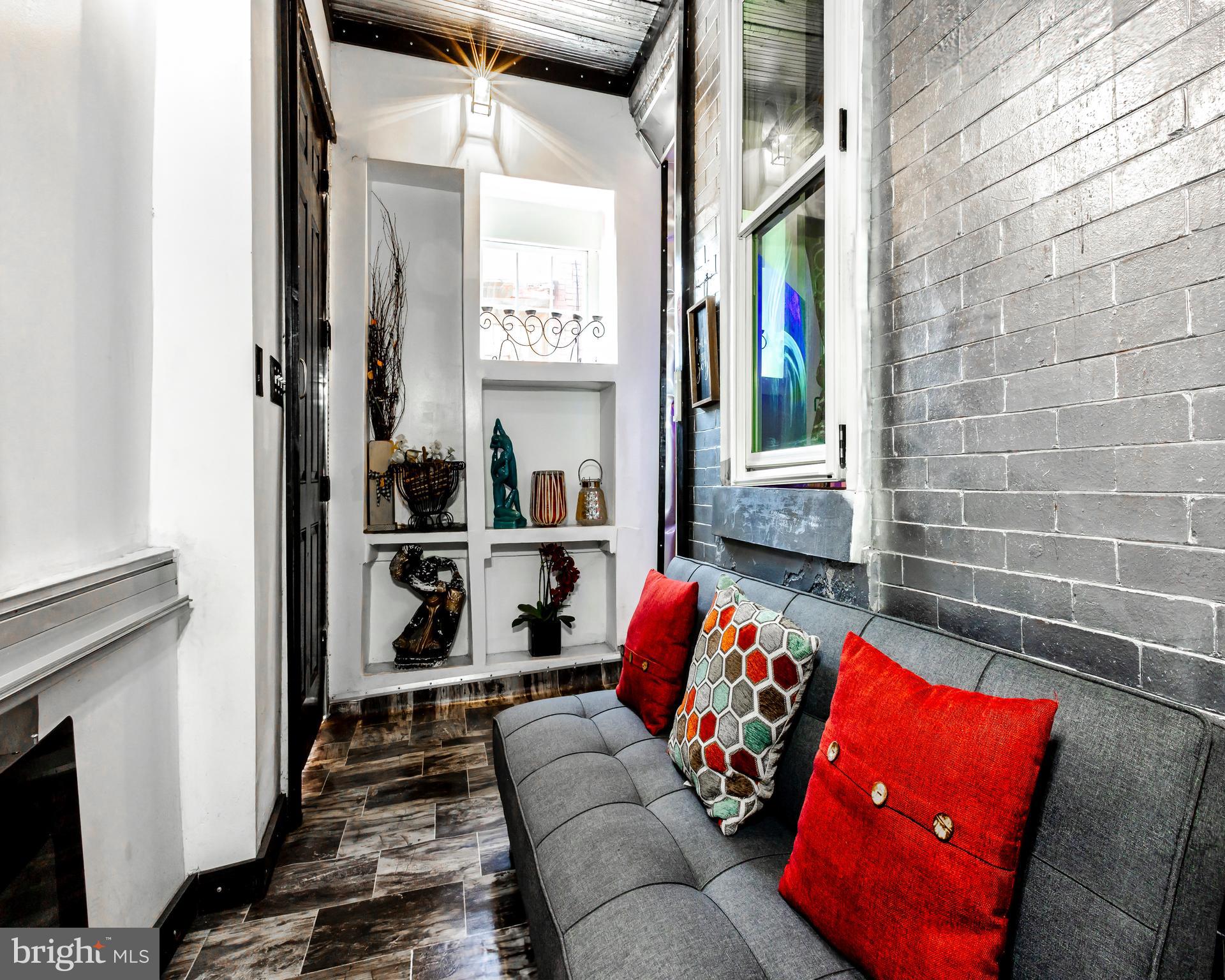 424 State Street Camden, NJ 08102 - Photo 4 of 36 a living room with furniture and a window