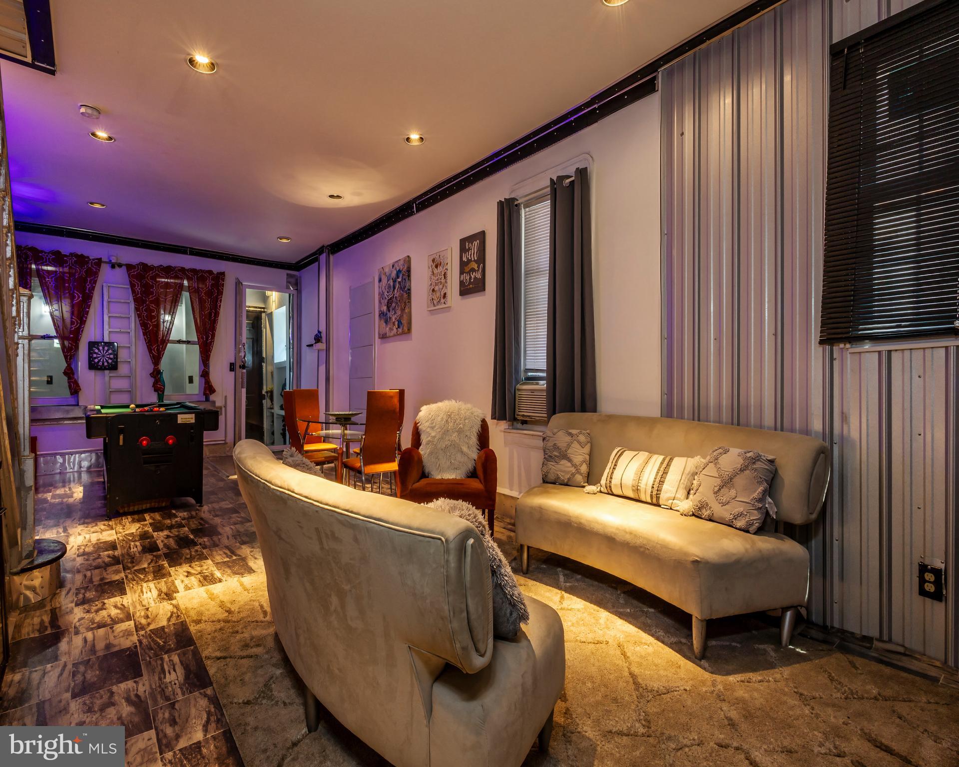 424 State Street Camden, NJ 08102 - Photo 9 of 36 a living room with furniture and a flat screen tv