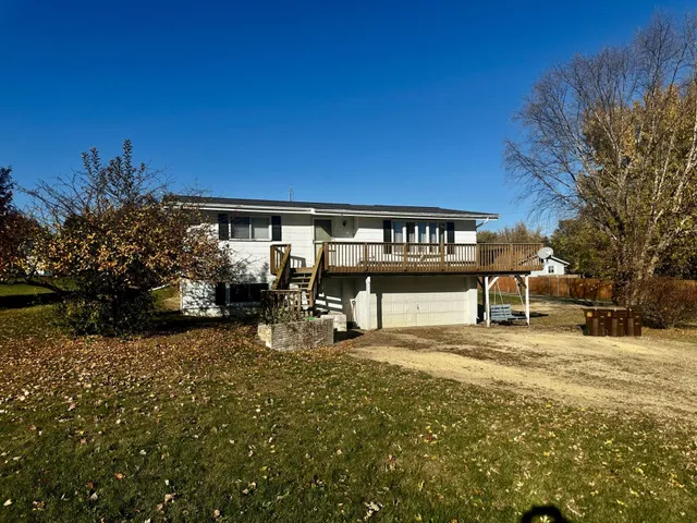 a view of a parking space with a building in the background