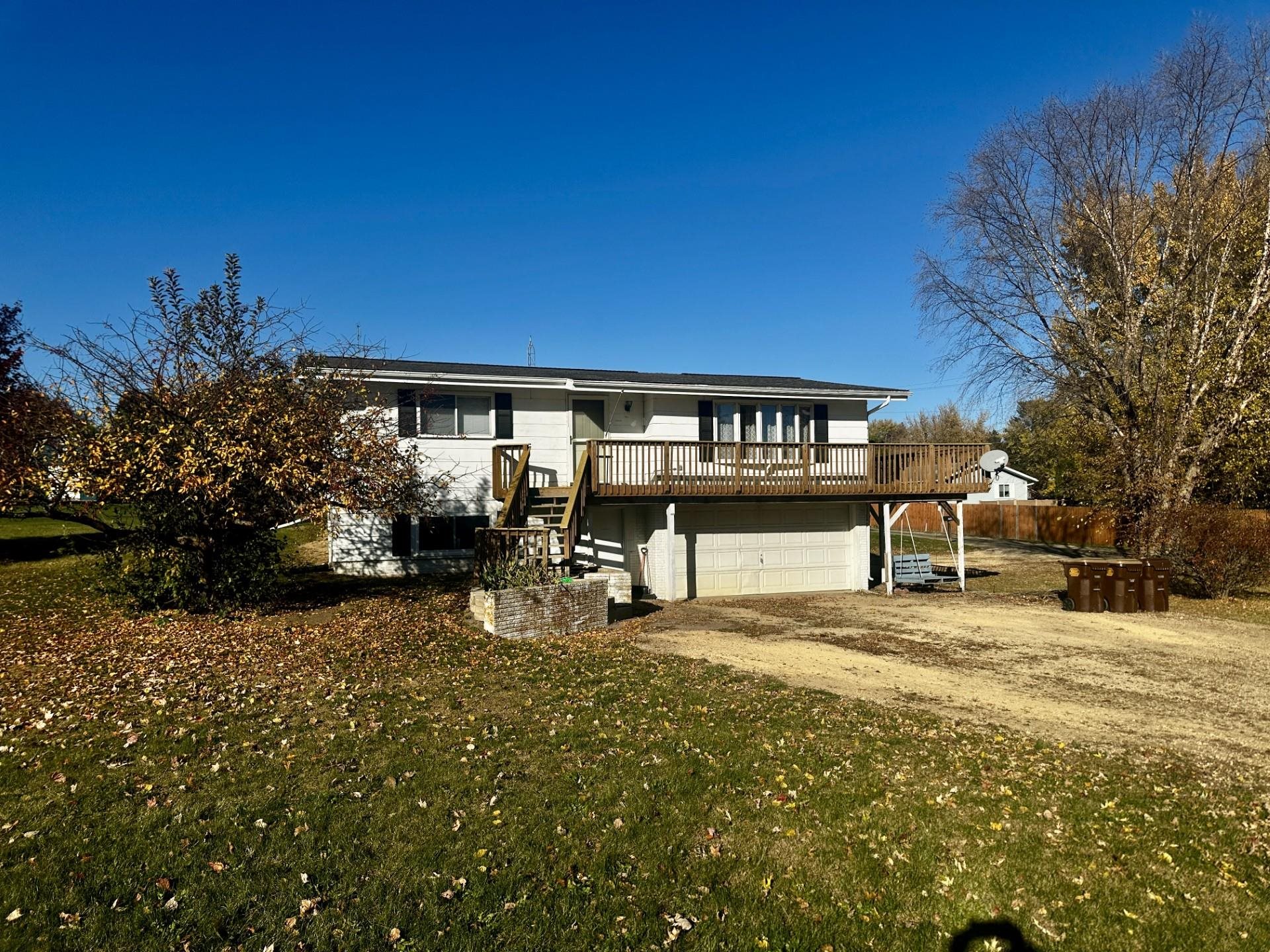 550 Hanabarger Street Lanark, IL 61046 - Photo 1 of 21 a view of a parking space with a building in the background
