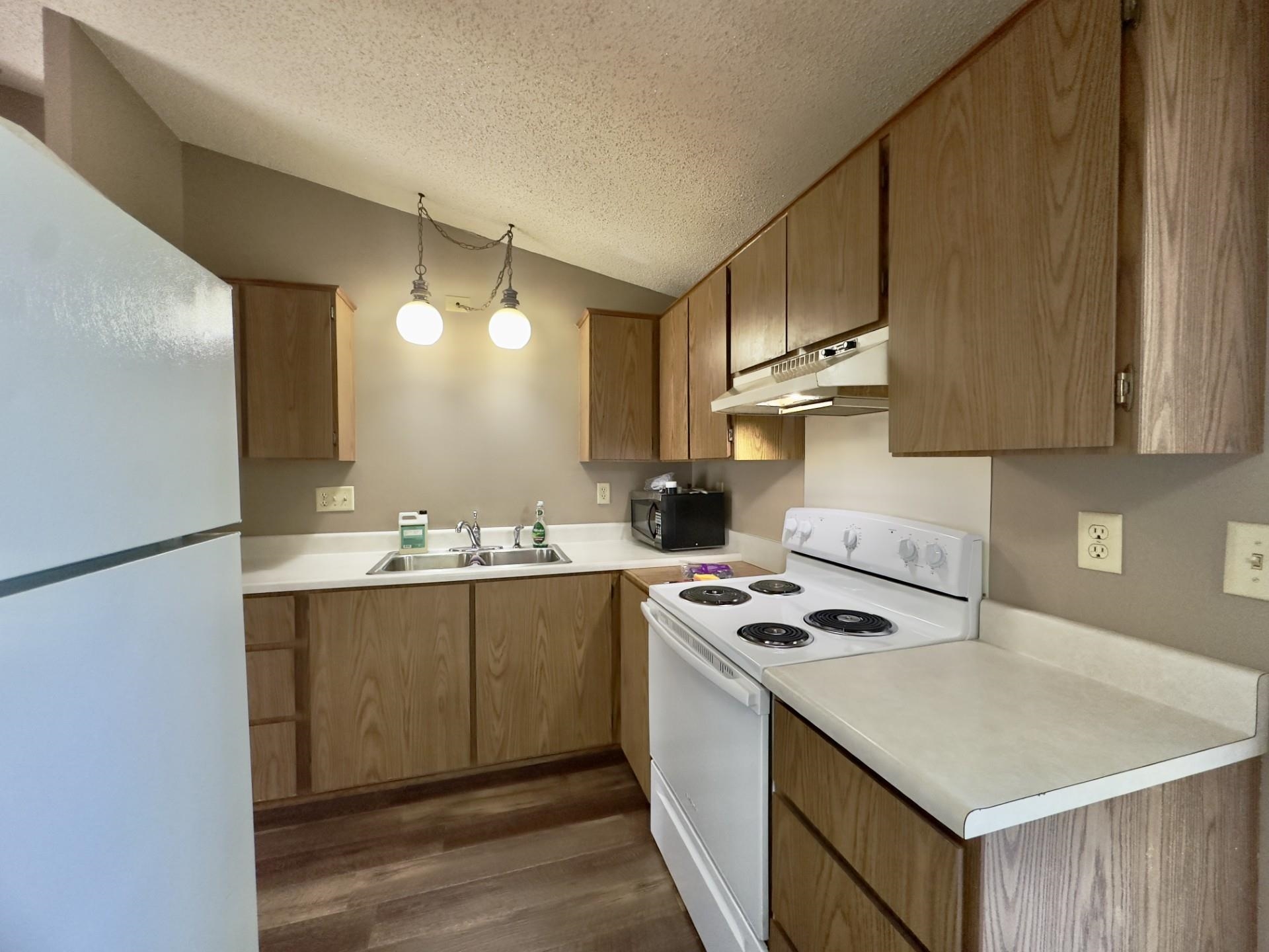 550 Hanabarger Street Lanark, IL 61046 - Photo 11 of 21 a kitchen with stainless steel appliances granite countertop a sink stove and refrigerator