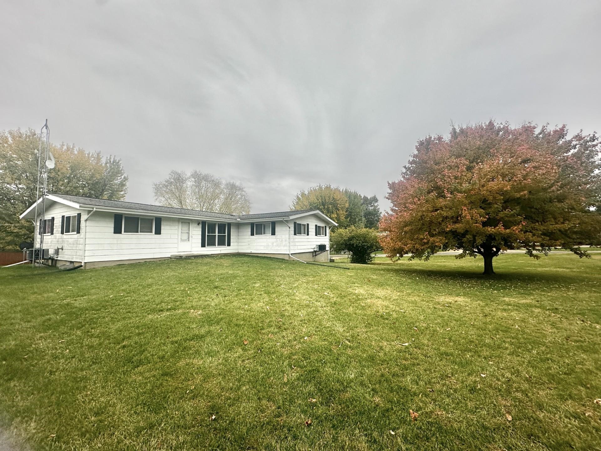 550 Hanabarger Street Lanark, IL 61046 - Photo 19 of 21 a front view of a house with a garden