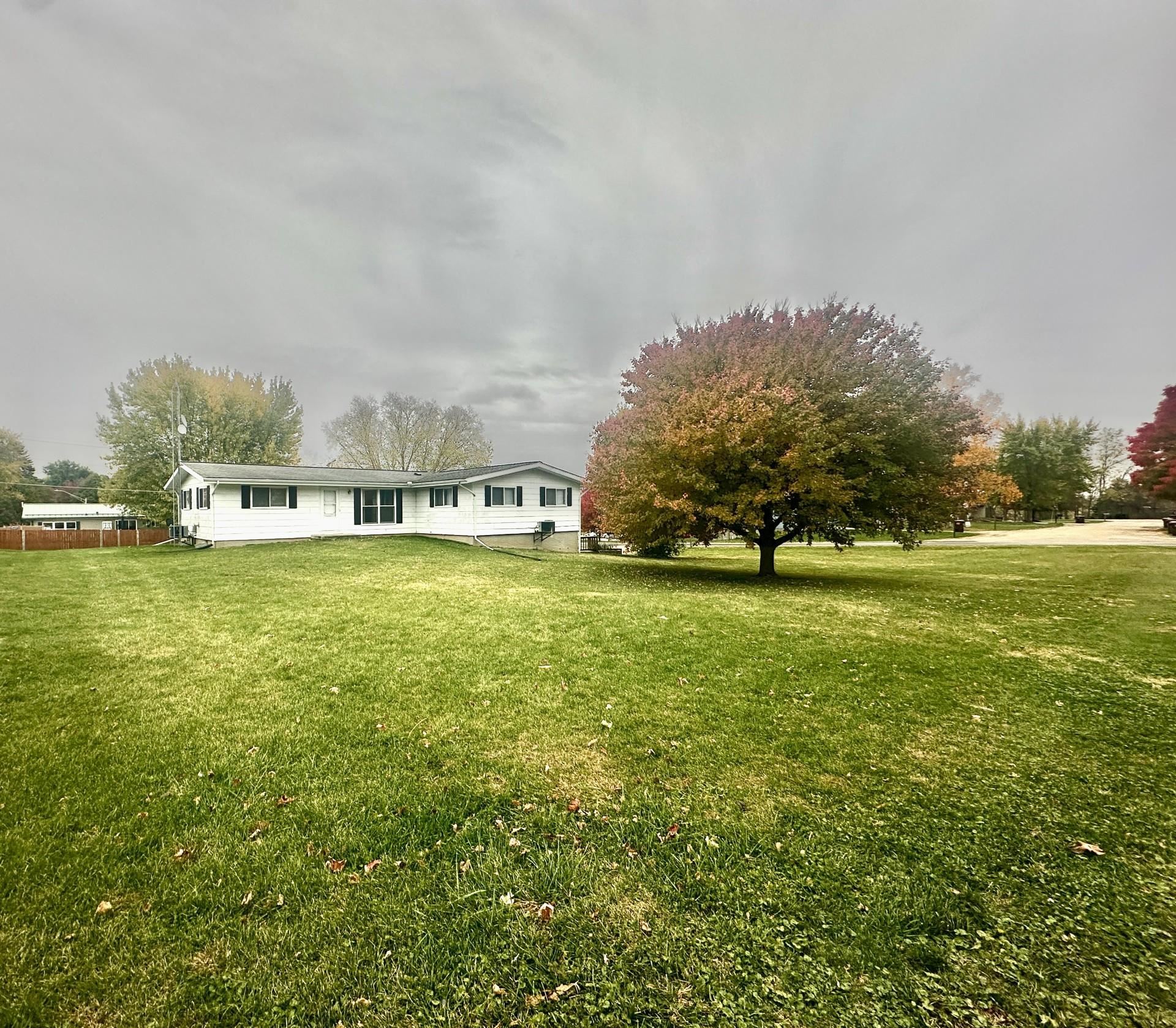 550 Hanabarger Street Lanark, IL 61046 - Photo 20 of 21 a view of a green field with trees in the background