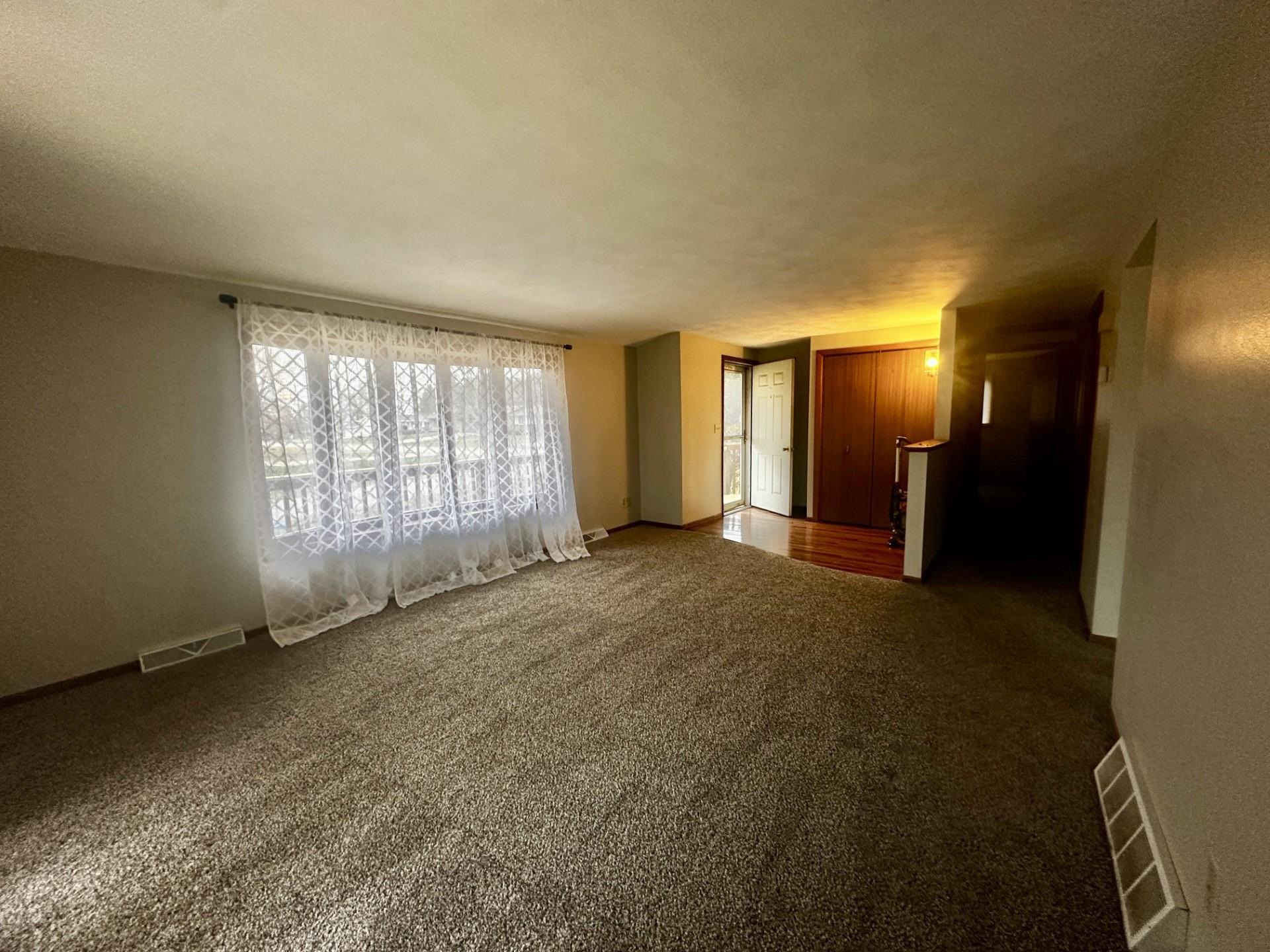 550 Hanabarger Street Lanark, IL 61046 - Photo 2 of 21 a view of a livingroom with a staircase