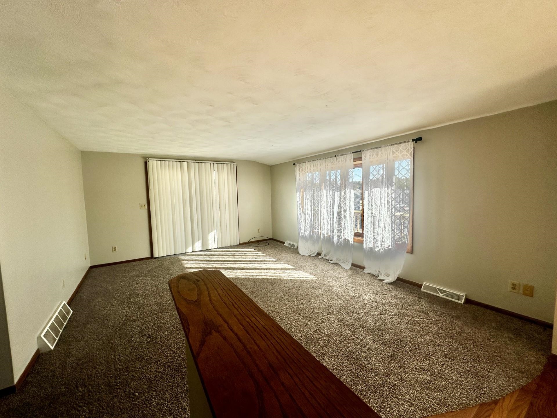 550 Hanabarger Street Lanark, IL 61046 - Photo 3 of 21 a view of an empty room and window